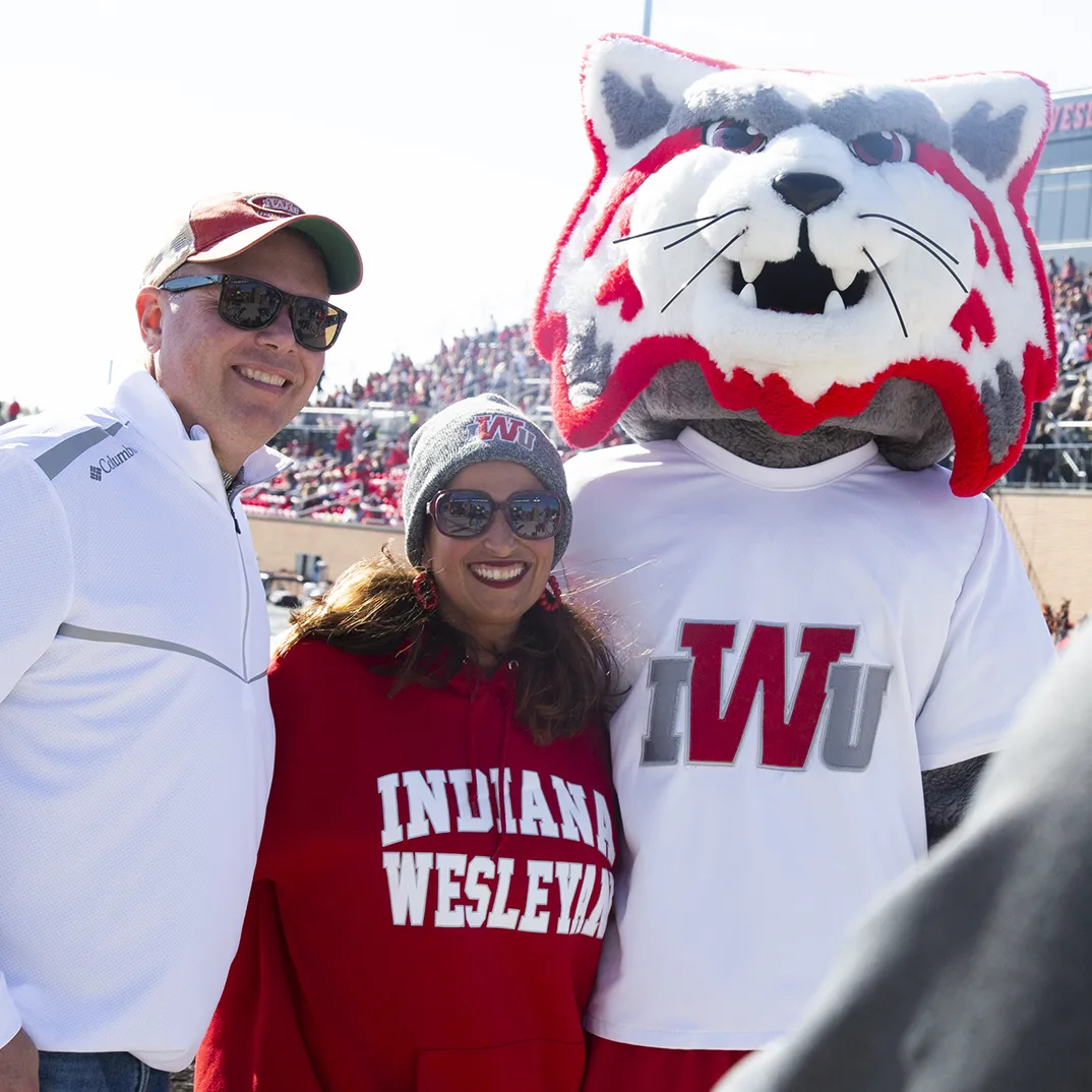 IWU Students playing cornhole at homecoming