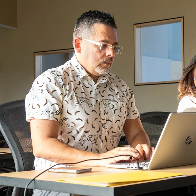 IWU online student on laptop