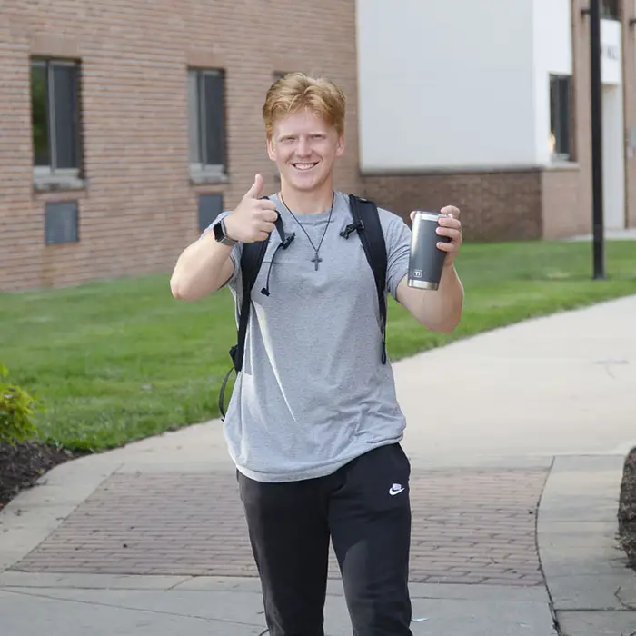 IWU student walking on campus