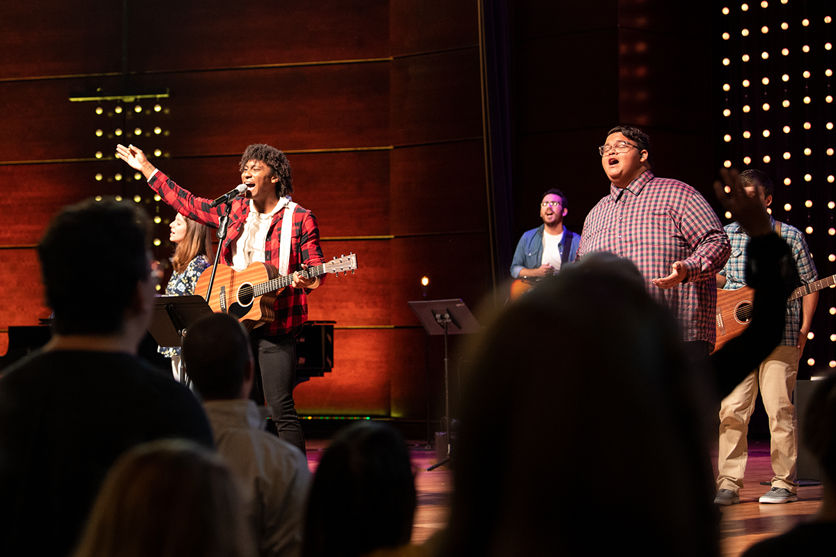 students singing in chapel