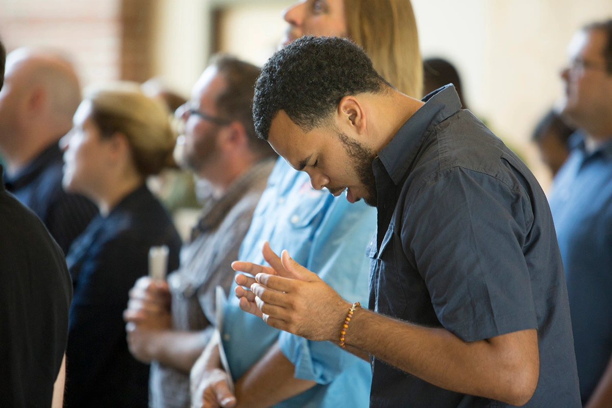 Student Worshipping at IWU