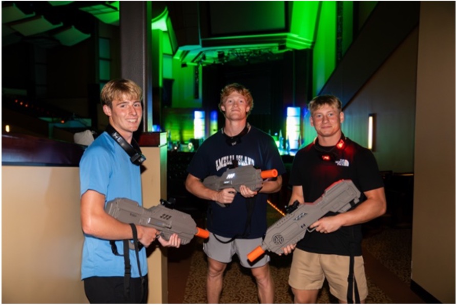 3 guys playing laser tag