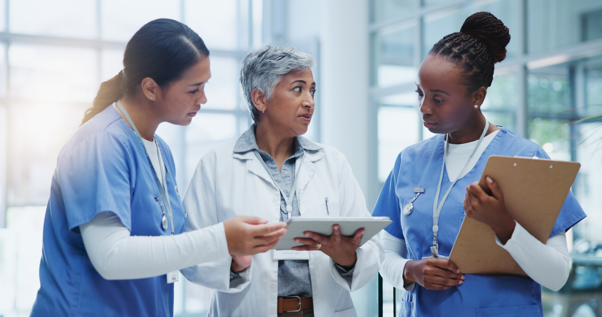 2 nurses and a doctor talking