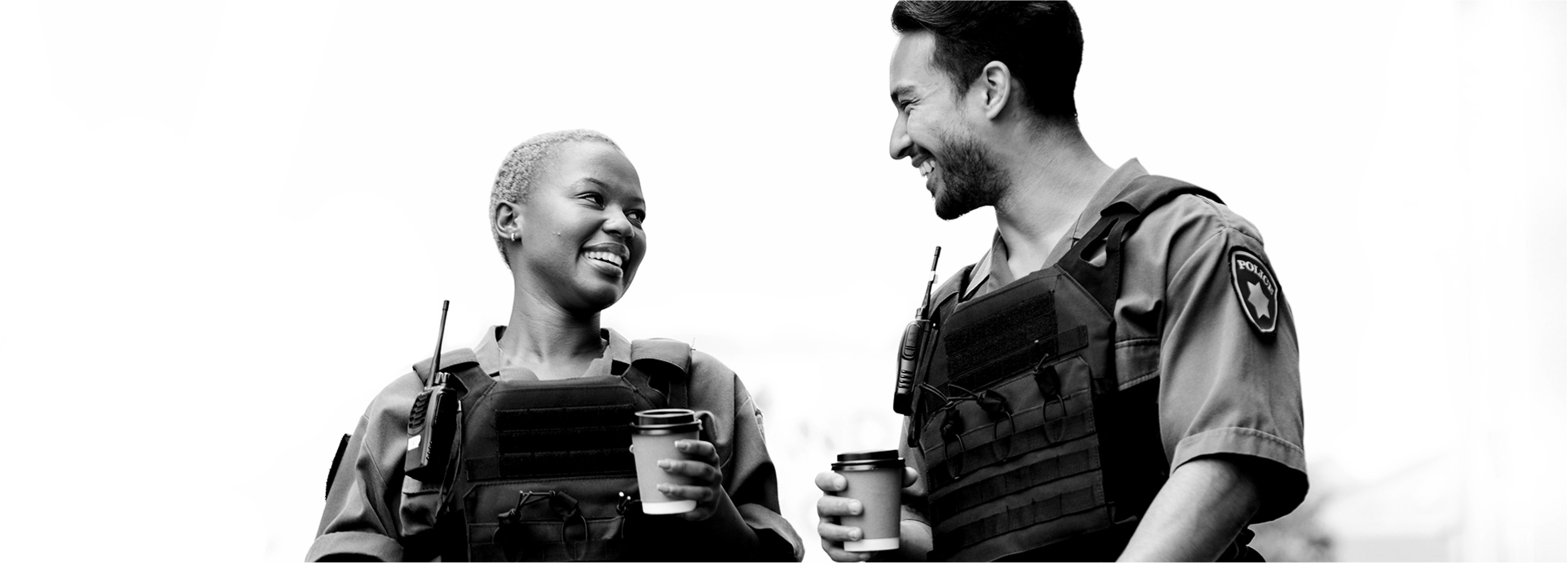 2 people facing each other and talking, grayscale